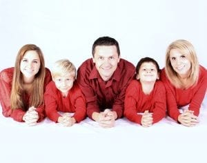 Family of five smiling